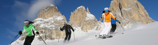 italy_dolomites_val-di-fassa_skiers.jpeg